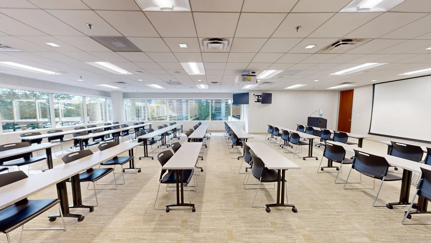 Auditorium with advanced acoustic ceiling panels and lighting